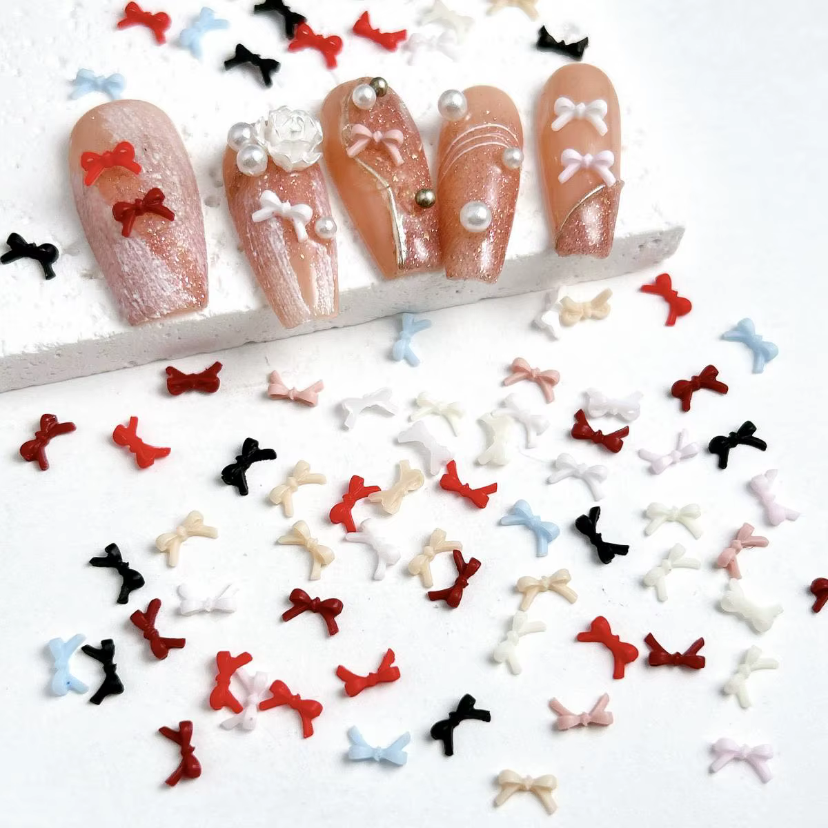 100 pièces couleur unie nœuds papillon résine Nail Art décorations 3D Mini mignon ligne arcs ongles