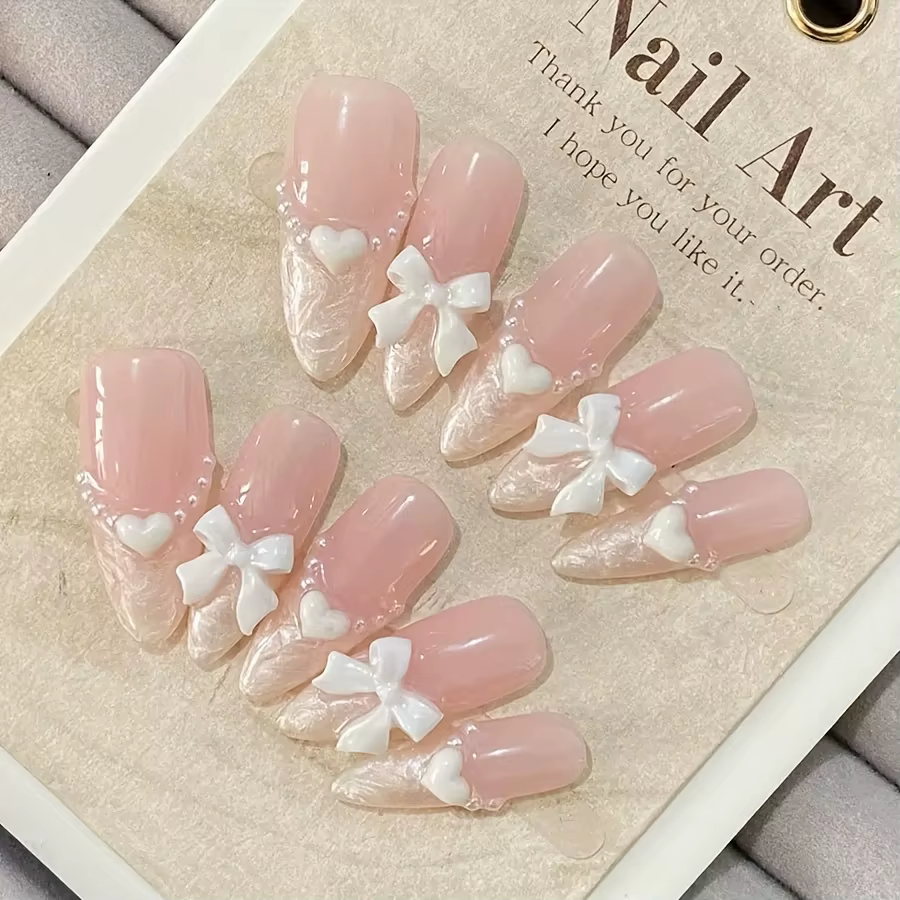 Faux ongles français haut de gamme en forme de cœur, nœud rose, faits à la main, patchs pour ongles