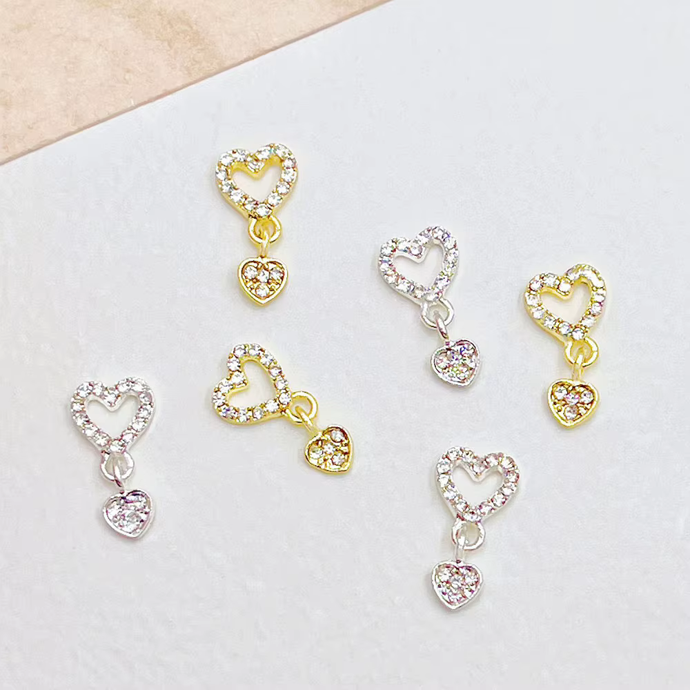 10 pièces coeur balancent ongles breloques 3D alliage luxe ongles strass argent or creux coeur ongle