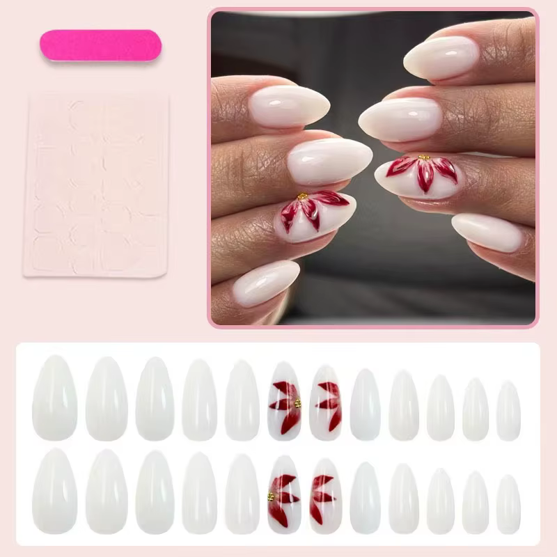 24 faux ongles ovales blancs mats avec décorations de fleurs de lys rouges peintes à la main