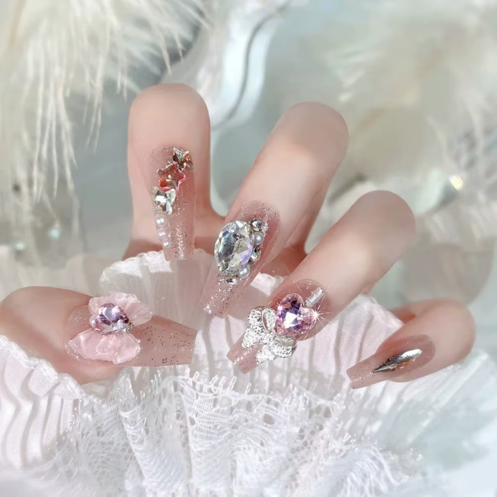 Faux ongles rose poudré avec nœud