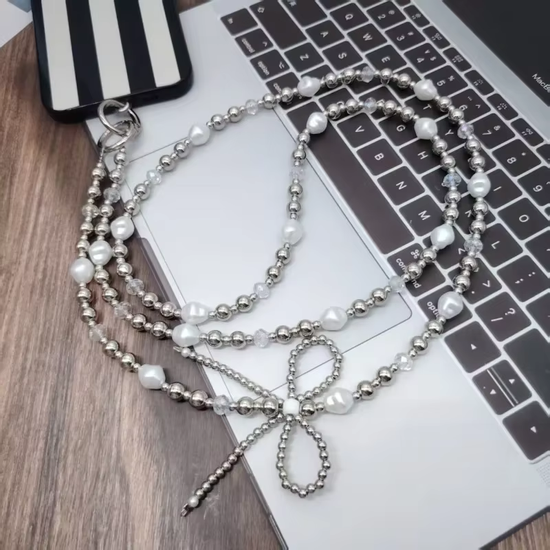 Nouvelle lanière créative pour téléphone portable, nœud en perles, ficelle de perles, accessoires de bagages à bandoulière, étui de téléphone, pendentif en chaîne