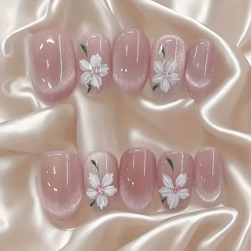 Faux ongles en forme d'oeil de chat rose peints à la main