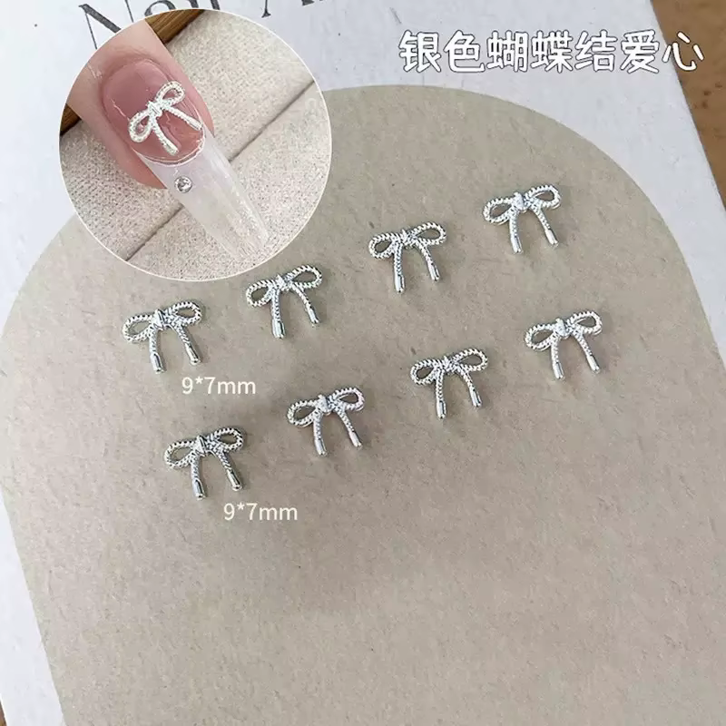 Décorations d'ongles avec nœud papillon en argent