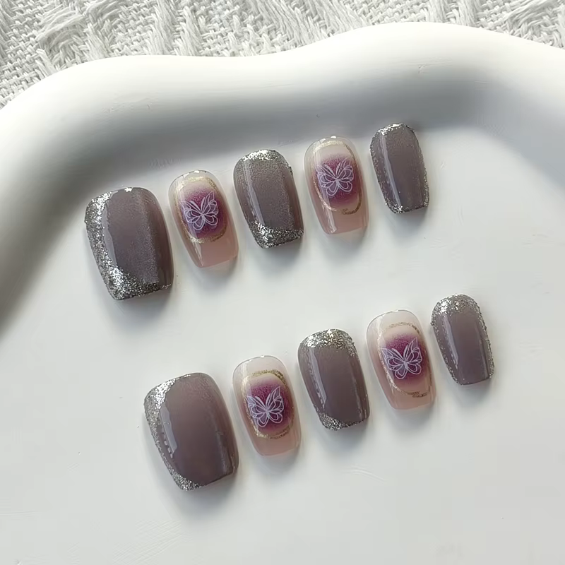 Femmes à la main papillon violet avec diamants conceptions scintillant oeil de chat presse sur les ongles pièce d'ongle