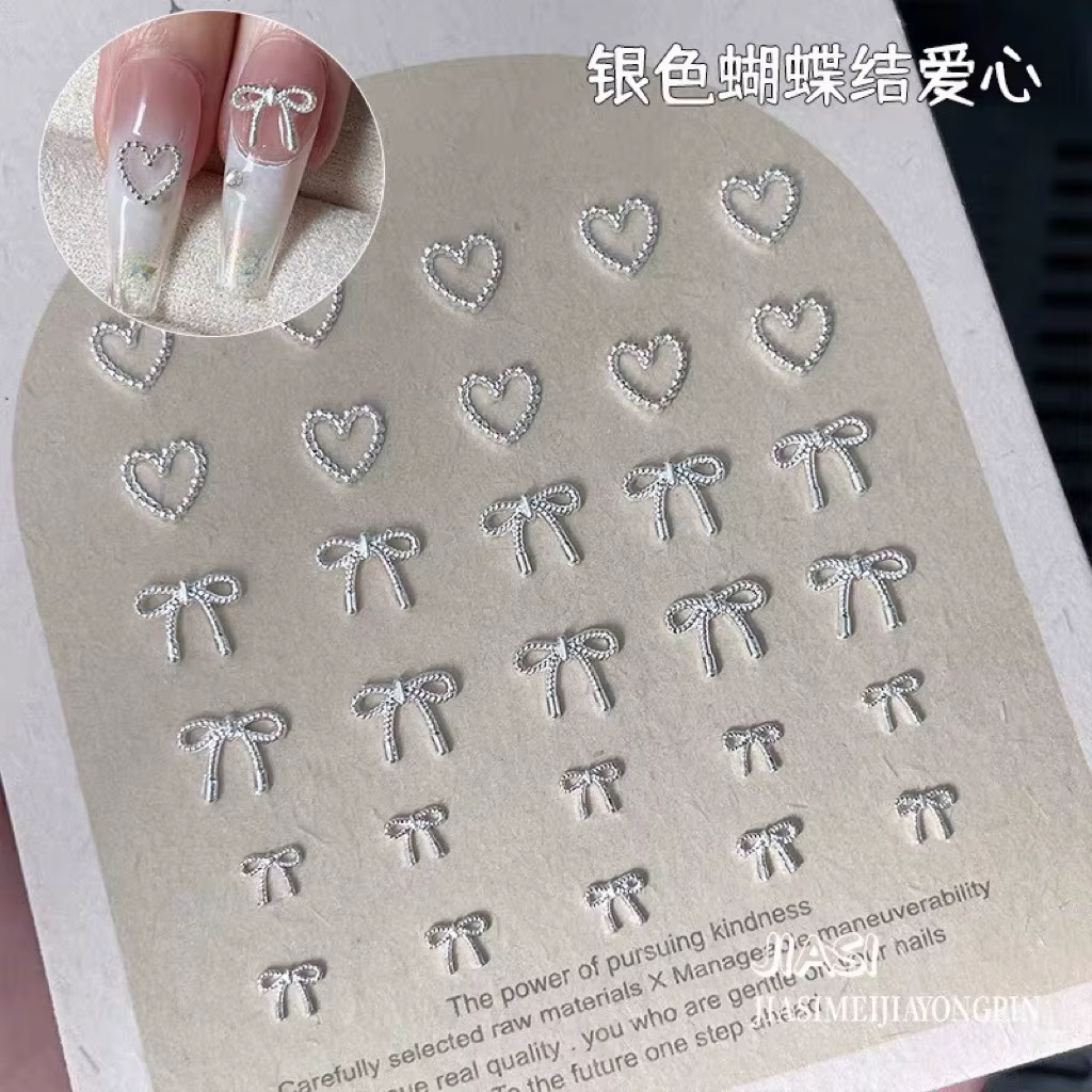 Décorations d'ongles avec nœud papillon en argent