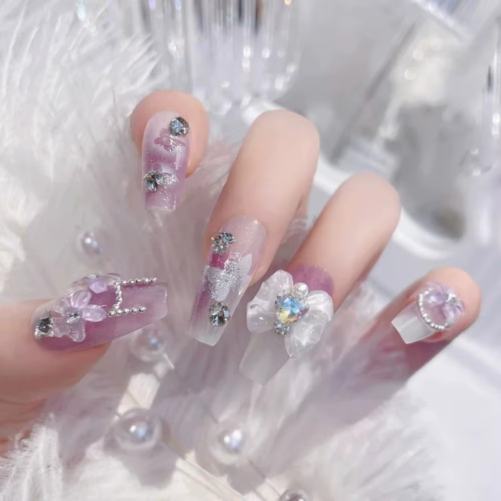 Faux ongles rose poudré avec nœud