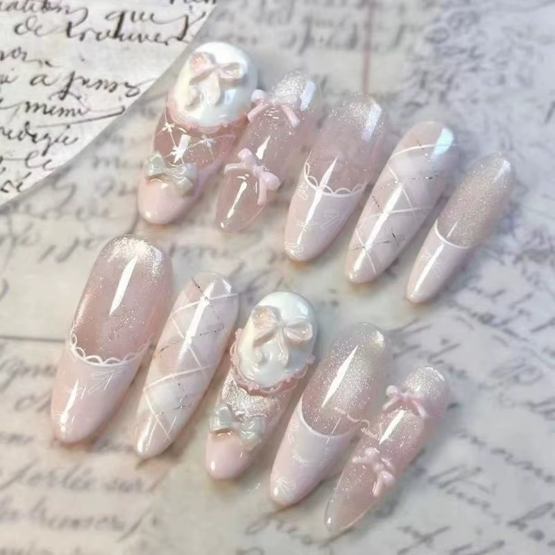 Faux ongles rose poudré avec nœud